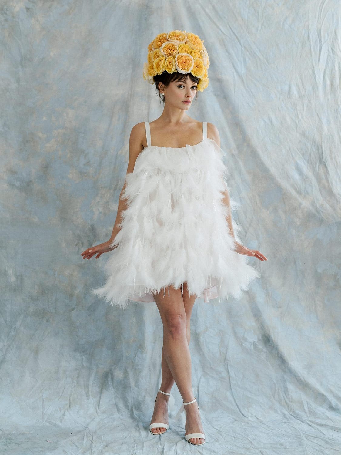 White Wedding Dress With Feathers And Rose Hat