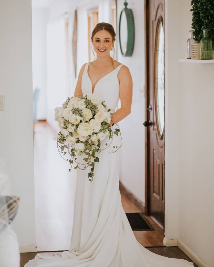 Bride Holding Bouquet of White Leonora Roses