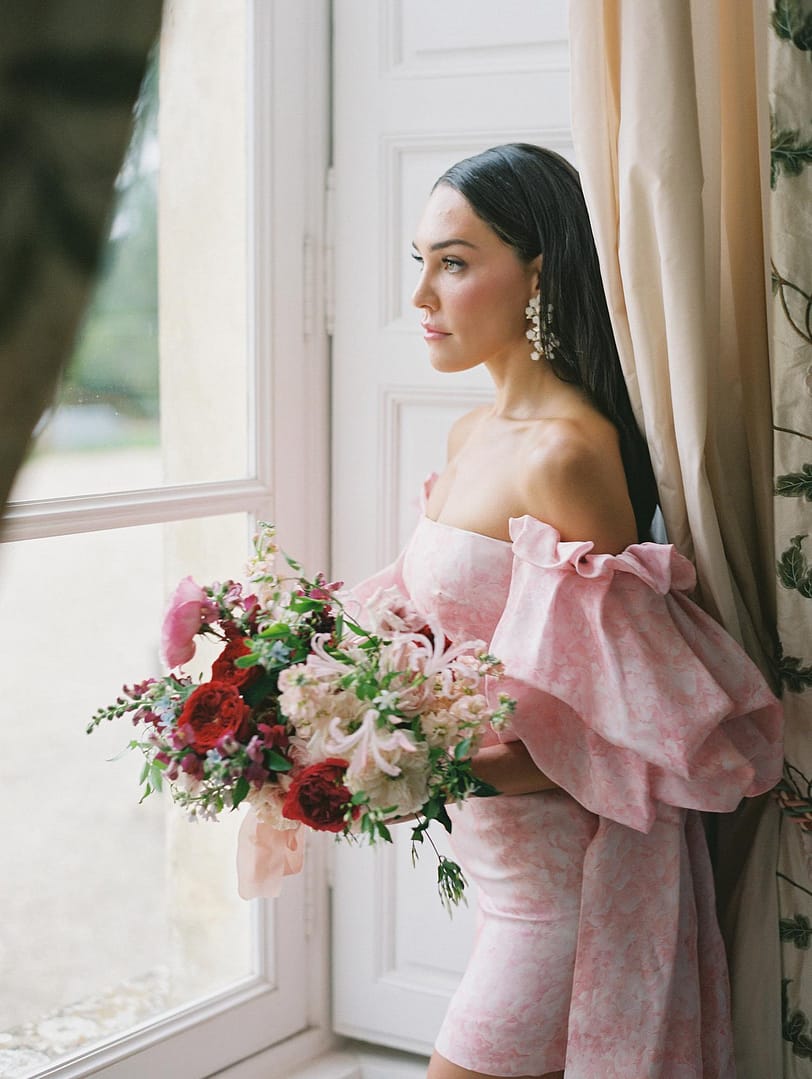 Bride In Pink Wedding Dress With Pink And Red Bouquet