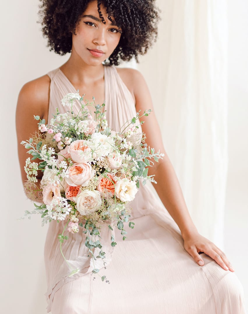 Bride Holding Bouquet of Juliet Roses